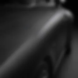 Close-up of a matte black car wrap showcasing its texture and finish