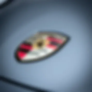 Close-up of Porsche emblem on a used car