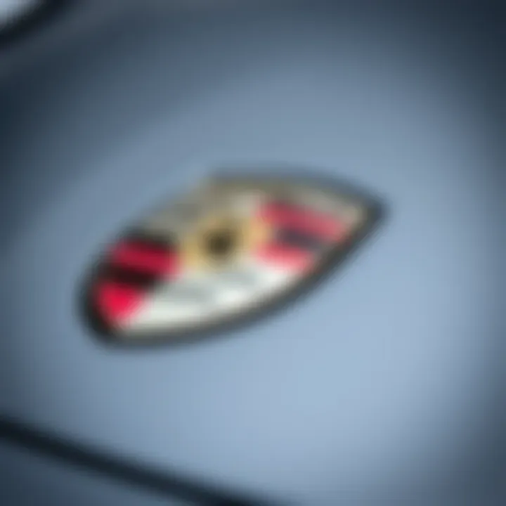 Close-up of Porsche emblem on a used car